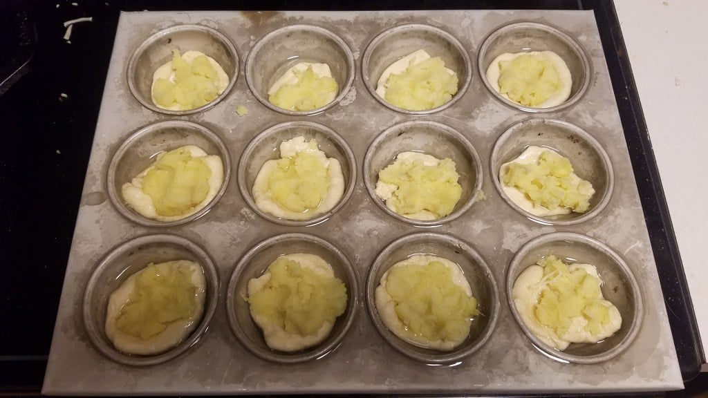 Dough with mashed sweet potato, ready to add cheese and toppings
